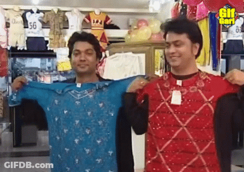 Two Men Holding Shirts In Front Of GIF Sign GIF