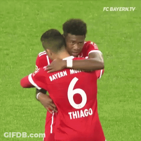 Two Men Holding Shirts With Nacho And Thiago GIF