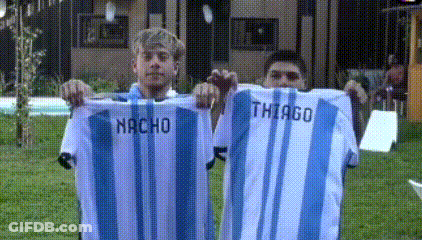 Two Men Holding Shirts With Nacho And Thiago GIF