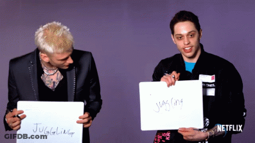 Two Men Holding Signs Saying Juggling And Juggler GIF