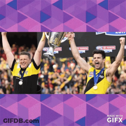Two Men Holding Trophy With Toyota Sign GIF