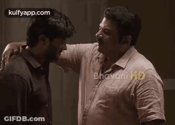 Two Men Hugging And Kissing On Cheek GIF