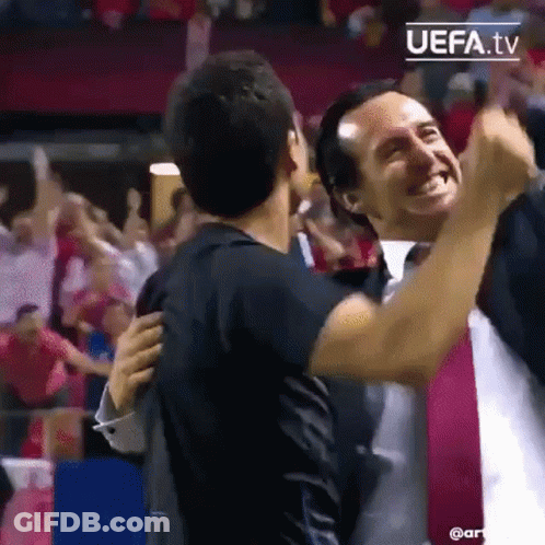 Two Men Hugging At Soccer Game GIF