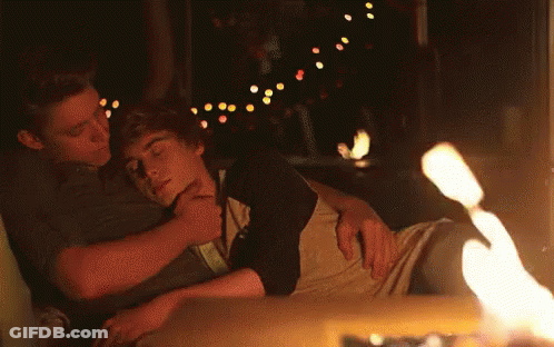 Two Men Hugging By Fireplace GIF