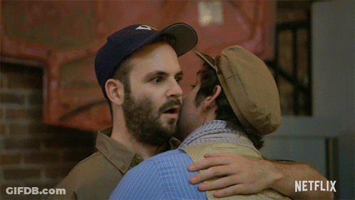 Two Men Hugging With Netflix Logo GIF