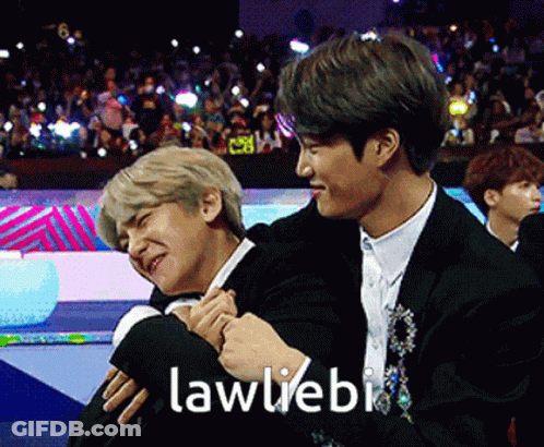 Two Men Hugging Each Other With The Words Lawliebi Written On The Bottom GIF