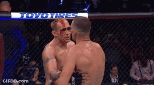 Two Men Hugging In Boxing Ring GIF