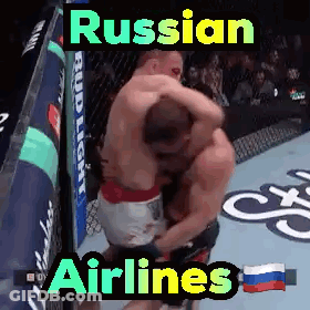 Two Men Hugging In Boxing Ring Russian Airlines GIF