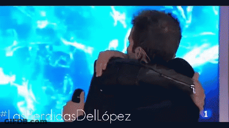 Two Men Hugging In Front Of #Lasperdidasdellopez GIF