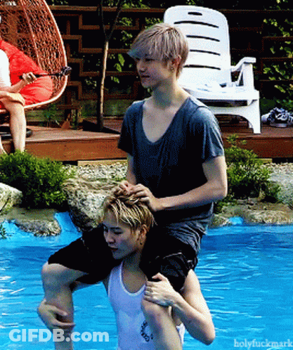 Two Men Hugging In Front Of Live Screen GIF