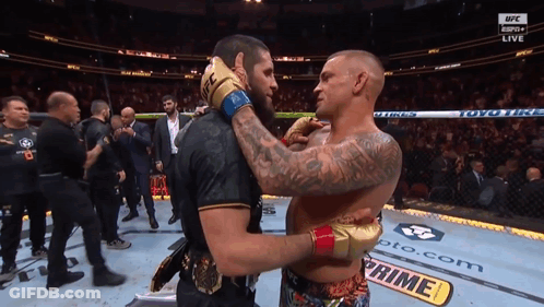 Two Men Hugging In UFC Ring GIF
