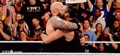 Two Men Hugging In Wrestling Ring GIF