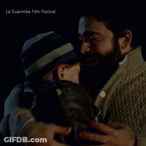 Two Men Hugging La Guarimba Film Festival GIF