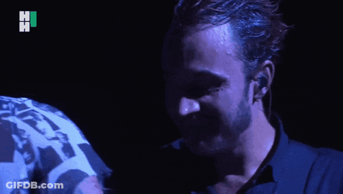 Two Men Hugging One Wearing Hi Shirt GIF