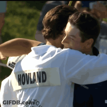 Two Men Hugging With One Wearing A Shirt That Says Hovland On The Back GIF