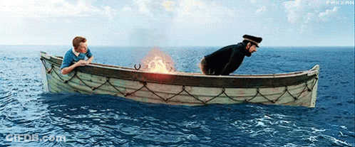 Two Men In A Boat In The Ocean With A Fire Coming Out Of The Side GIF