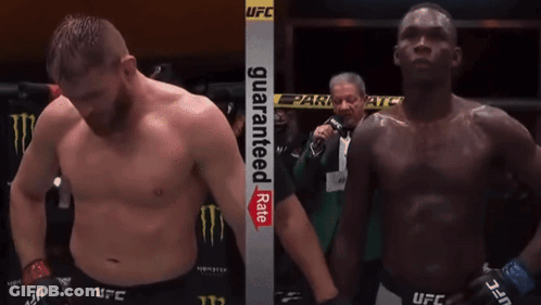 Two Men In A Boxing Ring With A Sign That Says Guaranteed Rate On It GIF
