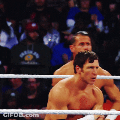 Two Men In A Boxing Ring With One Wearing A Shirt That Says ' New York ' GIF