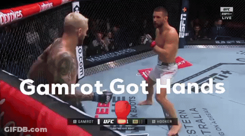 Two Men In A Boxing Ring With The Words Gamrot Got Hands On The Bottom GIF