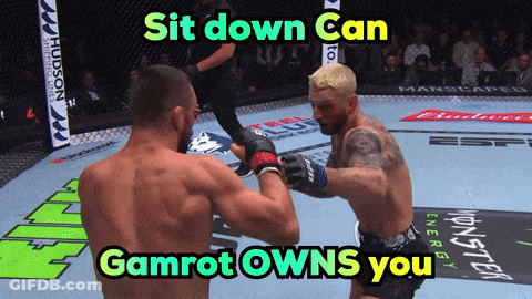 Two Men In A Boxing Ring With The Words Sit Down Can Gamrot Owns You Above Them GIF