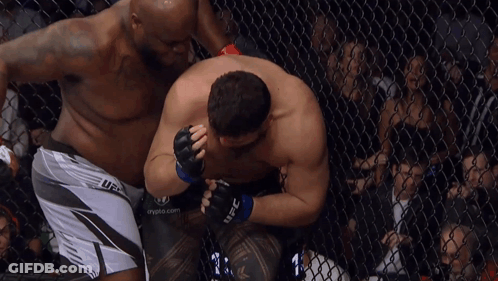 Two Men In A Cage With One Wearing A Ufc Short GIF