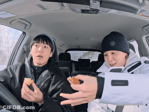 Two Men In A Car One Of Whom Is Wearing A Fusalp Jacket GIF