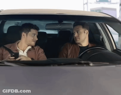 Two Men In A Car Talking To Each Other GIF