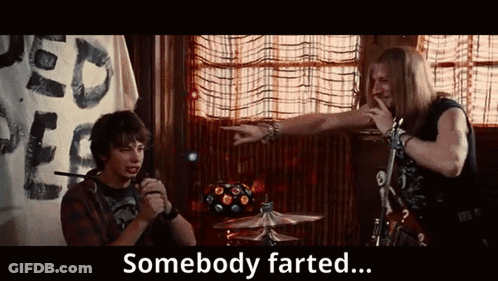 Two Men In A Room With The Words Somebody Farted Behind Them GIF