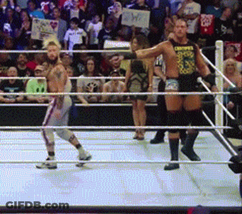 Two Men In A Wrestling Ring One Of Whom Is Wearing A Shirt That Says Choppers GIF