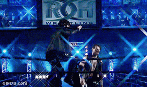 Two Men In A Wrestling Ring With A Sign That Says ' Roh Wrestling ' GIF