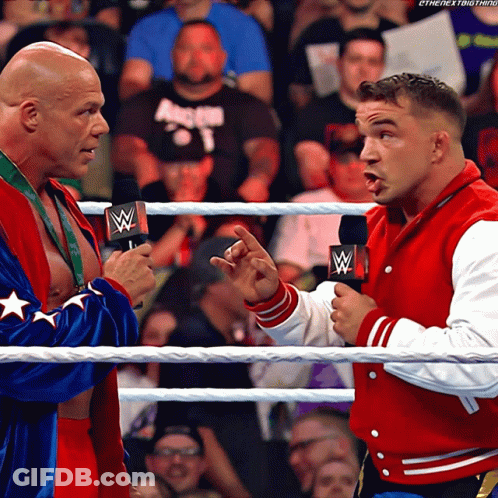Two Men In A Wrestling Ring With One Wearing A Red Jacket That Says The Next Thing GIF
