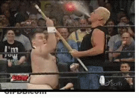 Two Men In A Wrestling Ring With One Wearing A Shirt That Says " I 'M Four " GIF