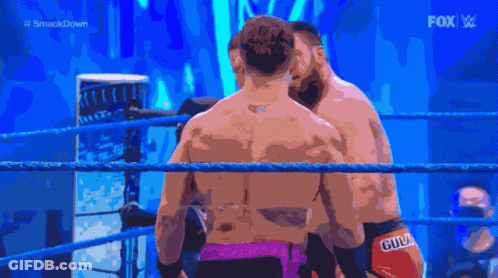 Two Men In A Wrestling Ring With The Fox Logo In The Background GIF