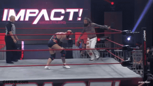 Two Men In A Wrestling Ring With The Words Impact Wrestling On The Wall GIF