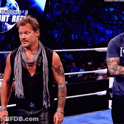 Two Men In A Wrestling Ring With The Words Jericho 'S Fight Reel On The Screen Behind Them GIF