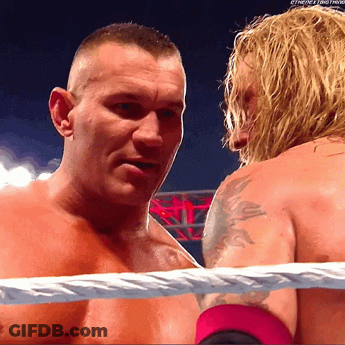 Two Men In A Wrestling Ring With The Words " The Next Thing " On The Bottom Right GIF