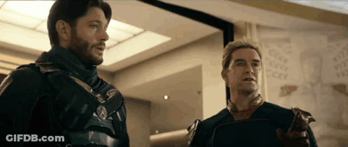 Two Men In Armor Standing Side By Side GIF