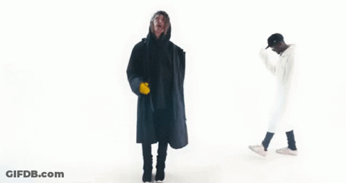 Two Men In Black And White Coats GIF