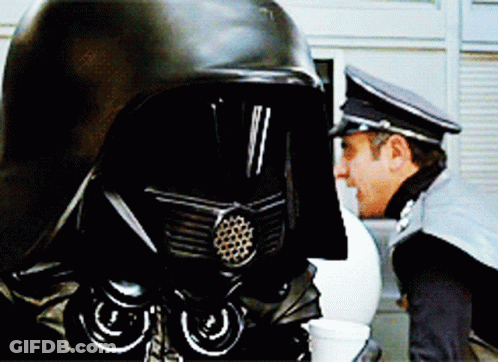Two Men In Black Helmets GIF