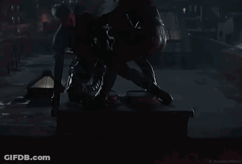 Two Men In Black Suits In Dark Room GIF