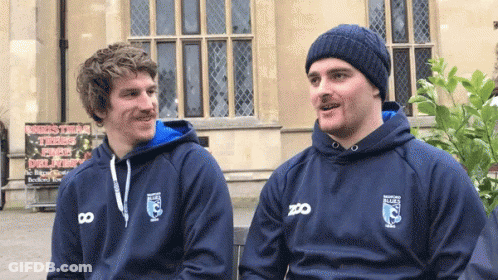 Two Men In Blue Zoo Sweatshirts GIF