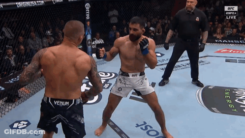 Two Men In Boxing Ring One In Venum Shorts GIF