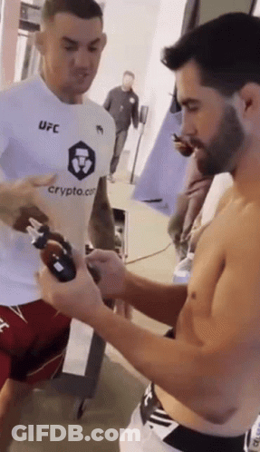 Two Men In Boxing Ring With Guaranteed Pain Sign GIF