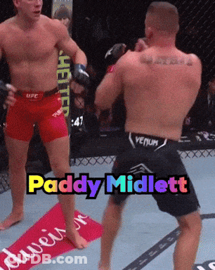 Two Men In Boxing Ring With Paddy Midlett GIF
