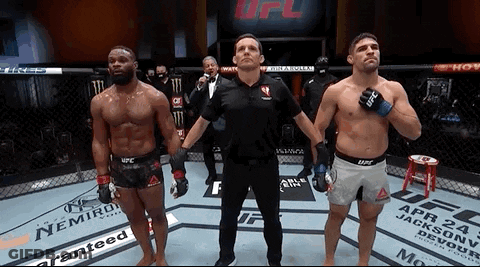 Two Men In Boxing Ring With Referee GIF