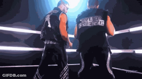 Two Men In Boxing Ring With Smack Down Vest GIF