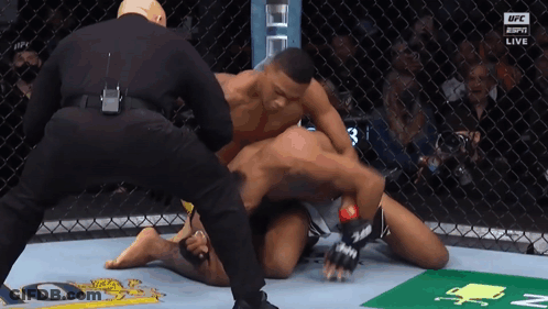 Two Men In Boxing Ring With Toyot Banner GIF