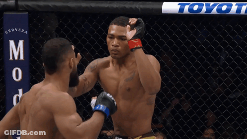 Two Men In Boxing Ring With Toyot Banner GIF