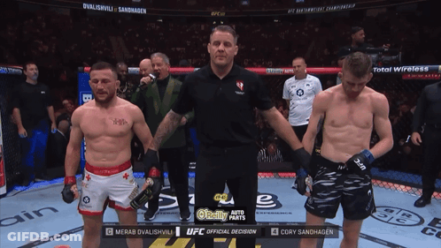 Two Men In Boxing Ring With UFC Official Decision GIF
