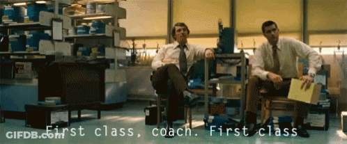 Two Men In Chairs Saying First Class Coach GIF